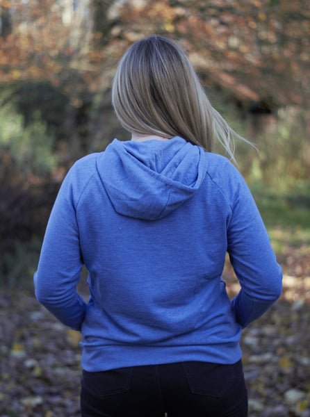 Photo of back of lady wearing a light blue hoody from The Cally Collection.