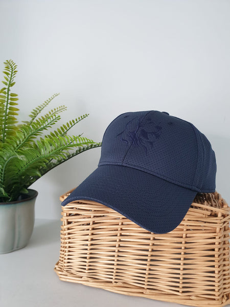 Photo of navy air mesh cap with The Cally Collection logo on the front panel